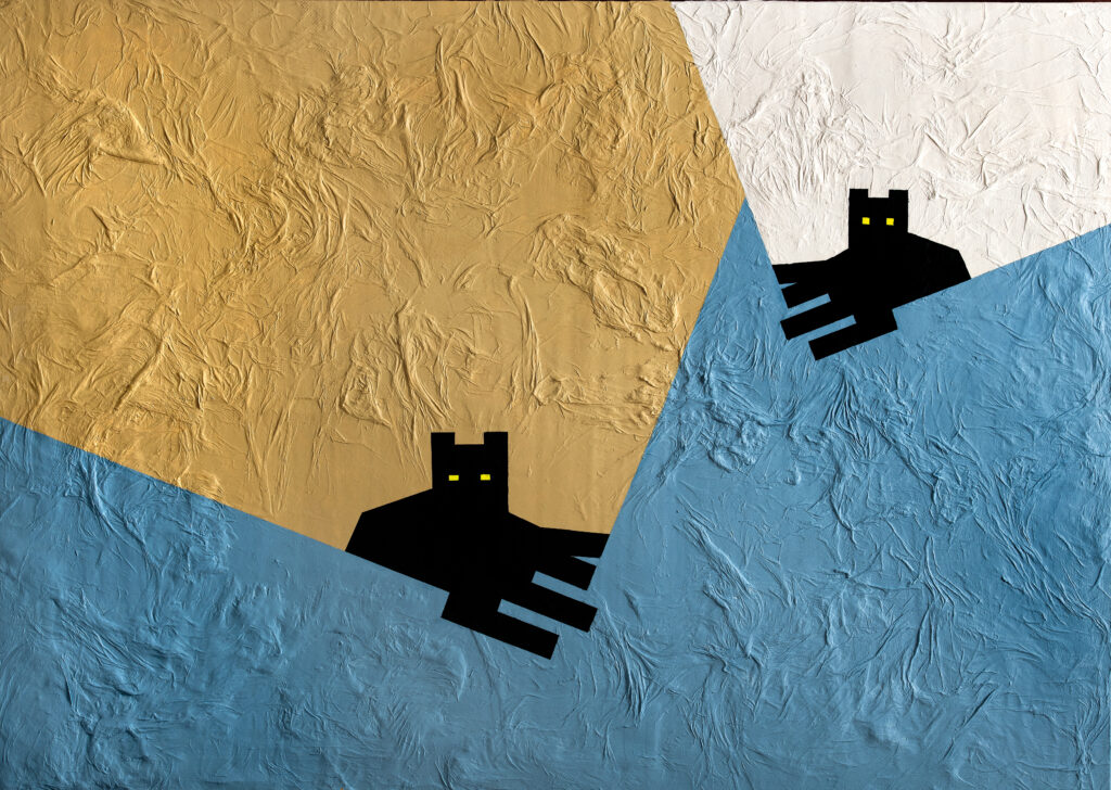 Due gatti neri guardano