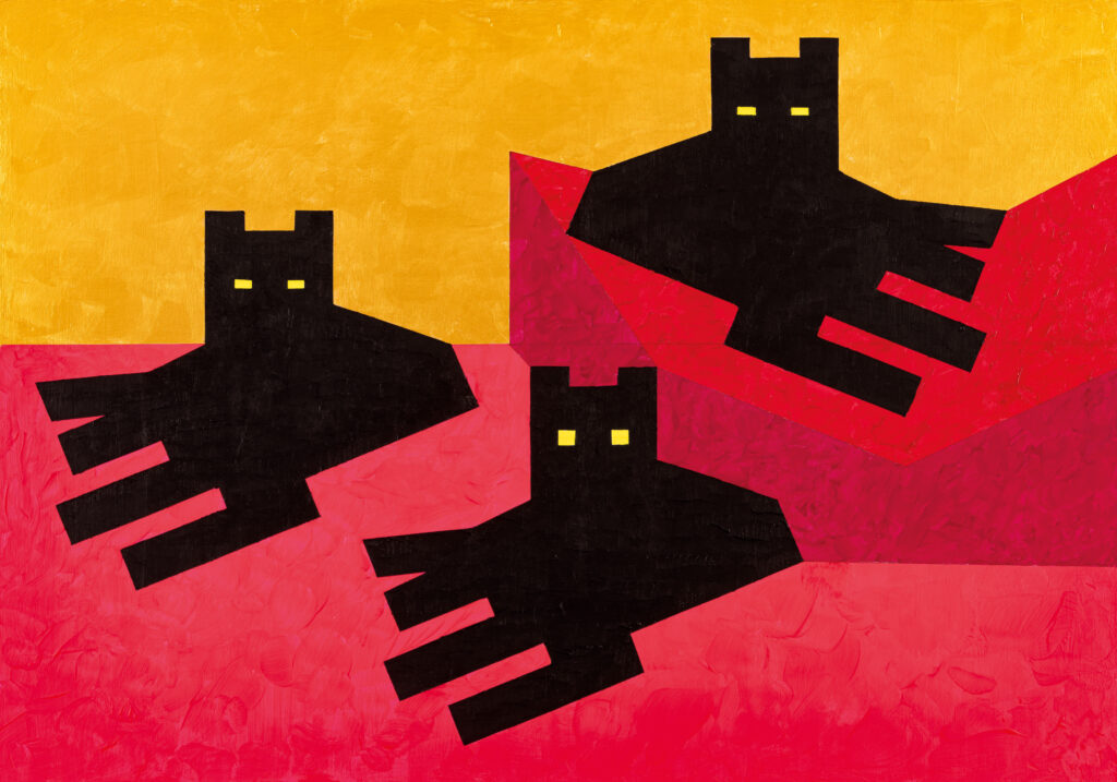 Tre gatti neri guardano